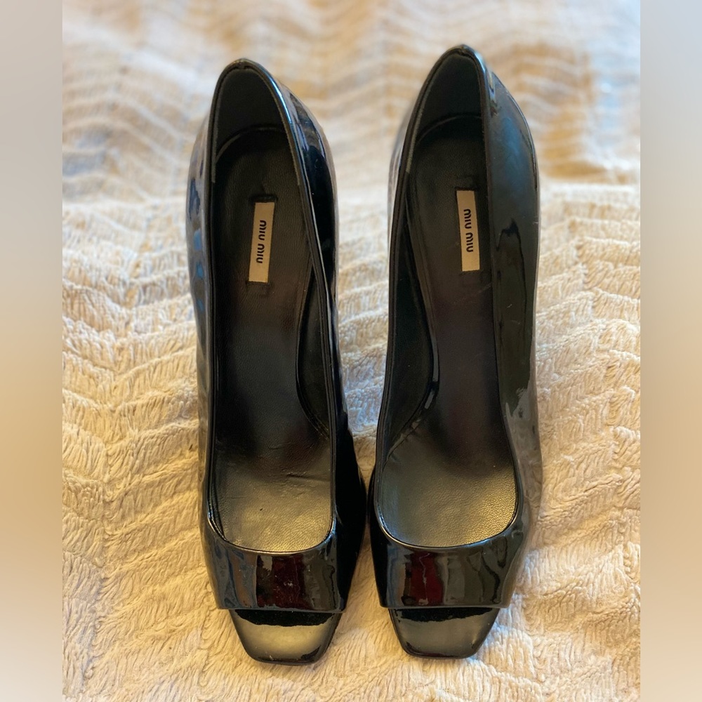 Black patent leather Miu Miu peep toe heels
